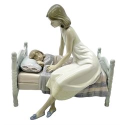 Lladro figure, Sleep Tight, modelled as a mother putting her daughter to bed, in original box, no 5900, year issued 1992, year retired 1997, H20cm