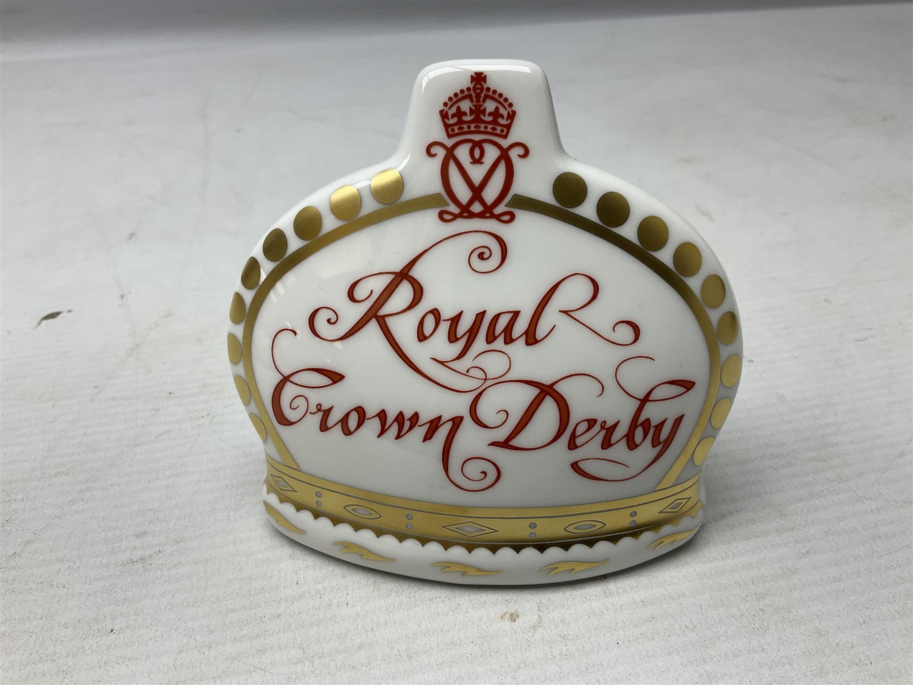 Four Royal Crown Derby teddy paperweights, comprising Teddy Cook, two Teddy George and Seated Teddy, all without stoppers, together with Crown Namestake with gold stopper 