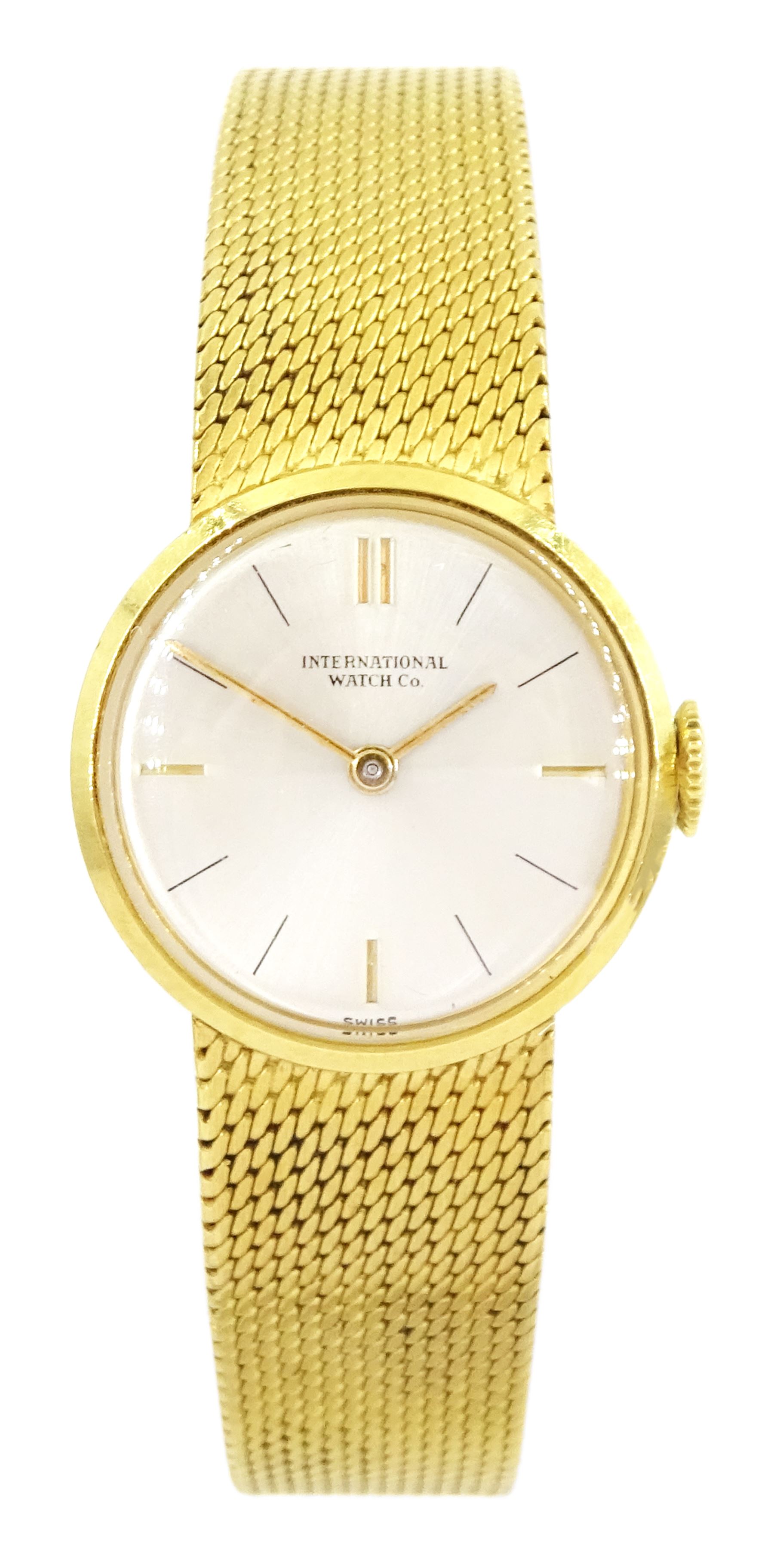 International Watch Company ladies 18ct gold manual wind wristwatch, silvered dial with baton hour markers, on integral 18ct gold bracelet, stamped 750, with guarantee dated 1968
