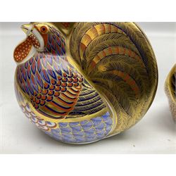 Two Royal Crown Derby paperweights modelled as a cockerel and hen, both with gold stoppers, tallest H10cm