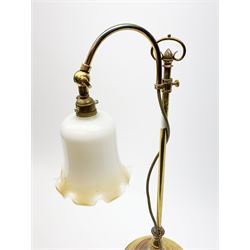A brass rise and fall students lamp, with opaque white frilled glass shade, H55cm.