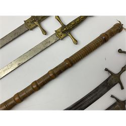 Near pair of short swords each with slightly curving 41cm fullered steel blade and all brass H-shaped hilt L52cm overall; plaited black leather whip; and reproduction pair of brass hilted swords, brass halberd blade and mace (7)