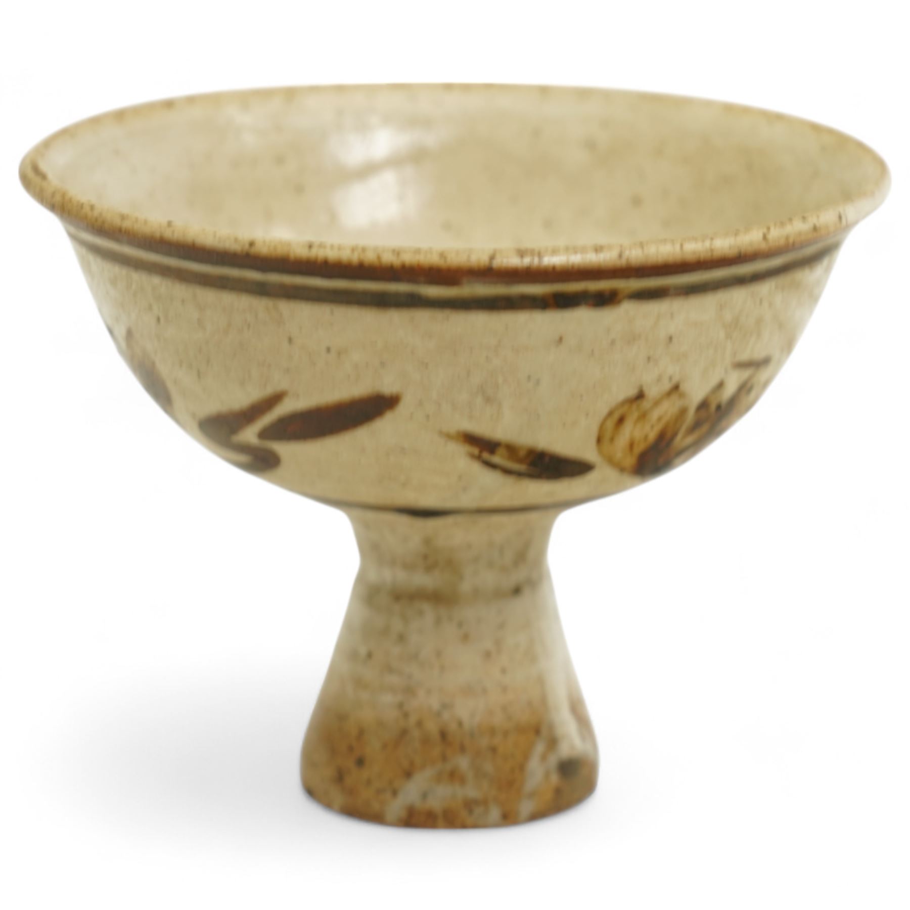 Chinese Song Dynasty (960–1279) Cizhou polychrome decorated wine stem cup, deep rounded sides over tall flared foot, decorated in iron-brown slip with stylized floral spray on a creamy-white slip ground beneath a clear glaze, base of foot unglazed, W11cm H8cm