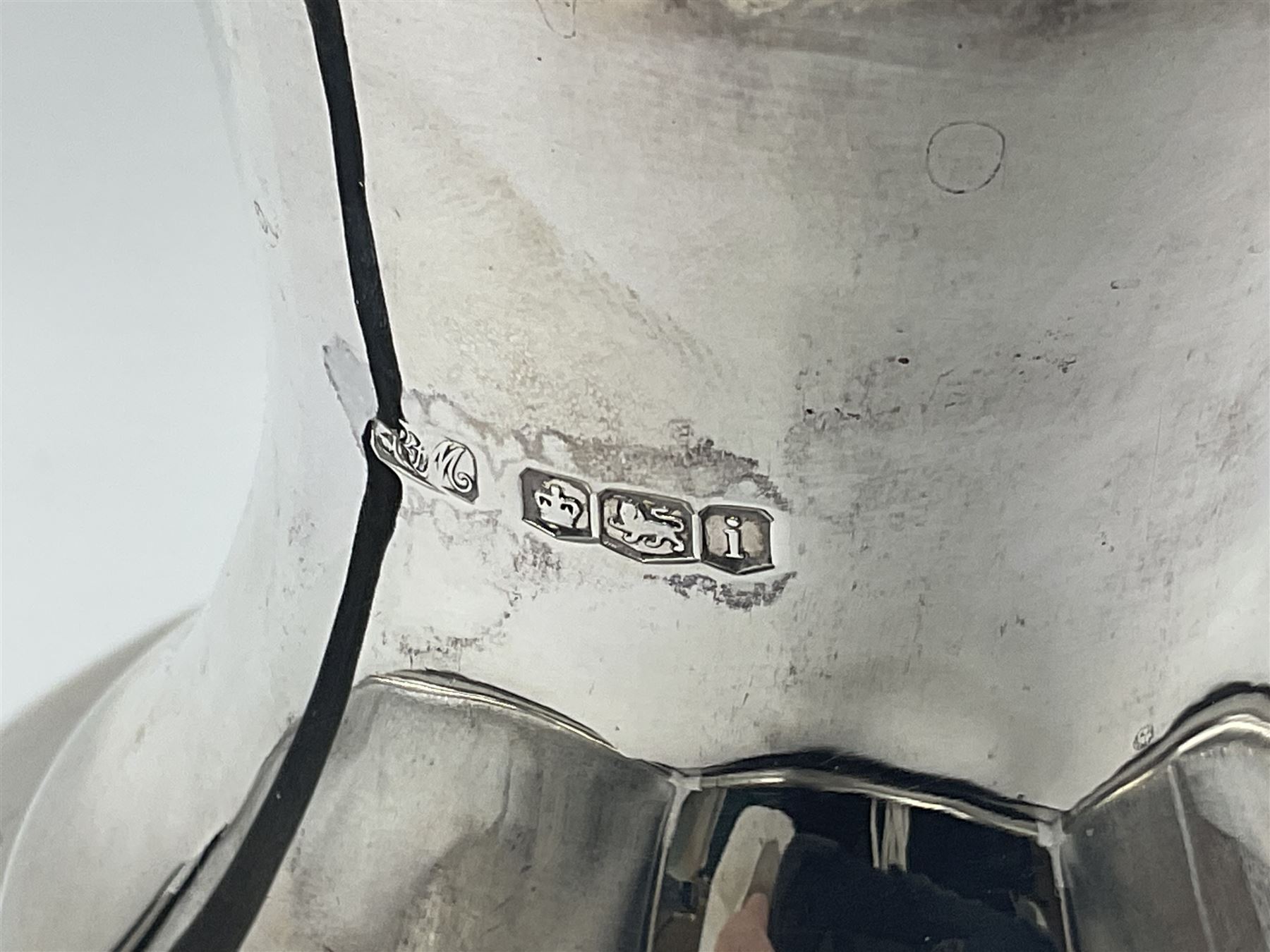 1920s five-piece silver tea service, comprising teapot, coffee pot, hot water pot, twin handled open sucrier and milk jug, each of squat circular form with shaped rim, the teapot, coffee pot and hot water pot each with ebonised handle and finial, the sucrier and milk jug with acanthus capped scroll handles, all upon circular foot, hallmarked R F Mosley & Co, Sheffield 1926 & 1927, tallest H24cm