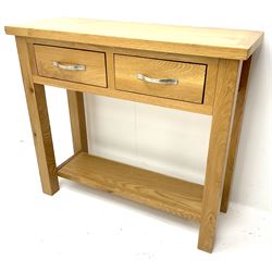 Light oak side table, two drawers, stile supports joined by solid under tIer