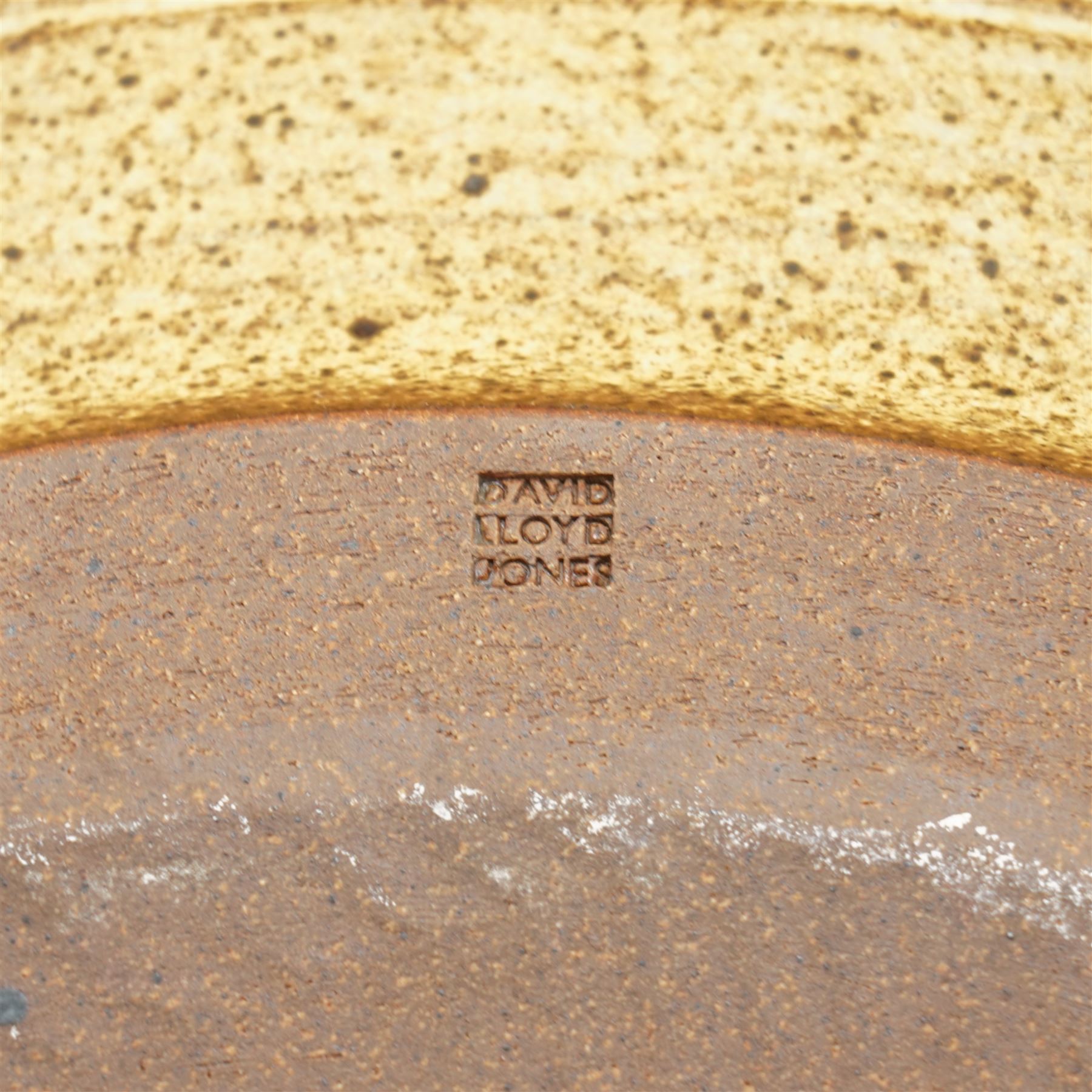 David Lloyd Jones (1928-1994): large studio pottery charger, the 'Eboracum' script in brown against a light green ground with brown speckles, impressed mark to base, D47cm 