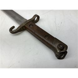 Austrian Model 1895 carbine NCO's knife bayonet with 25cm fullered steel blade; in steel scabbard with webbing frog L39cm overall; and Spanish Model 1941 Bolo bayonet with 25cm fullered steel blade No.6412D; in steel scabbard (2)