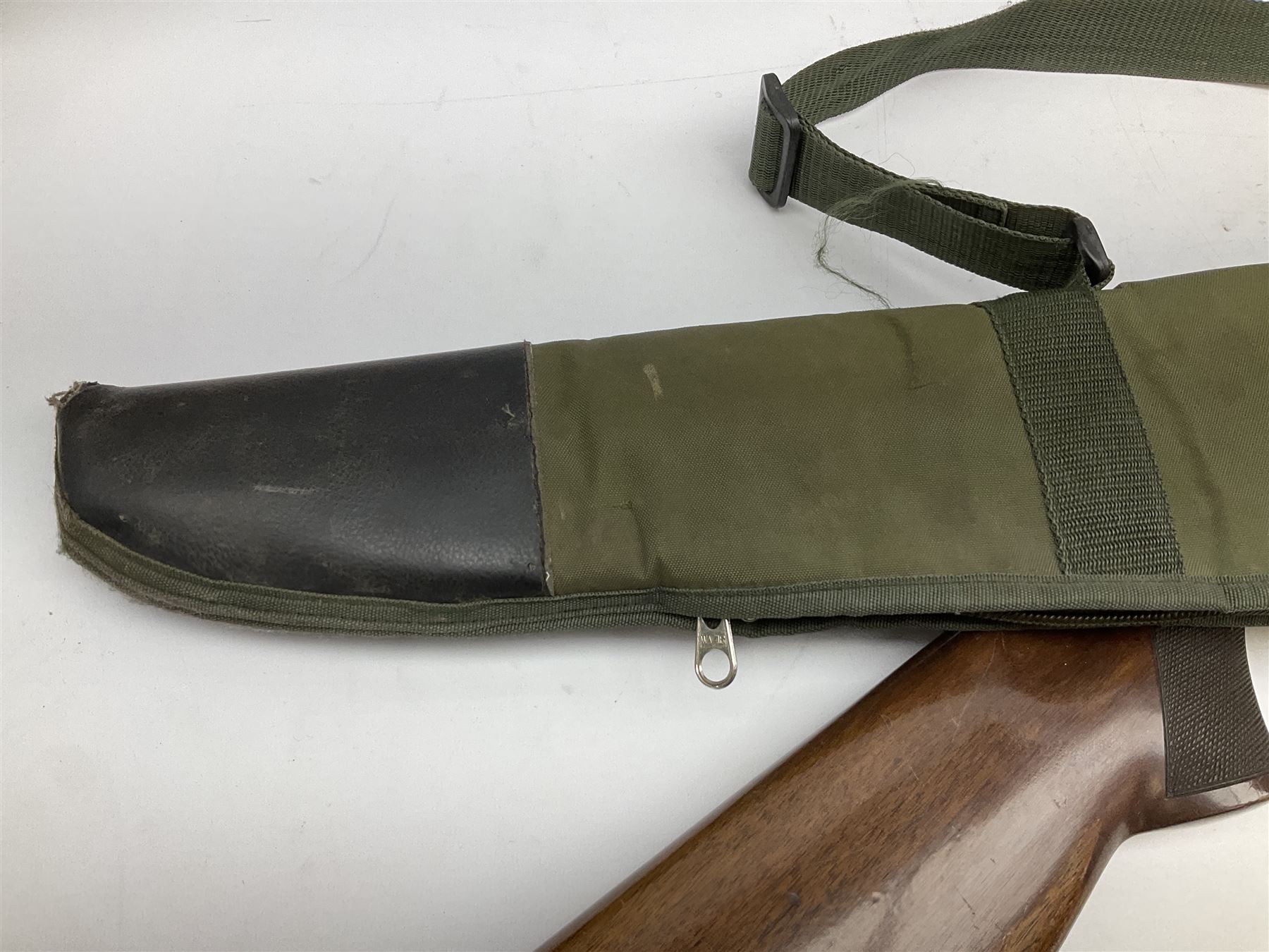 Winchester Japan 5500 12-bore by two-and-three quarters over-and-under double barrel boxlock ejector sporting gun, with 71cm barrels, ventilated rib and barrels, the walnut stock with chequered pistol grip and fore-end, single selective trigger and top safety, serial no.K542927E, L115cm overall; in gun sling SHOTGUN CERTIFICATE REQUIRED