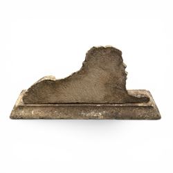 Neoclassical design cast stone garden lion, modelled recumbent with raised and flowing mane, on rectangular plinth base, with flat plain reverse, in weathered finish