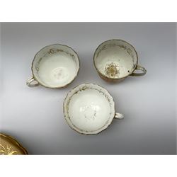 19th century tea wares, comprising milk jug, cream jug, lidded sucrier, three breakfast cups, two teacups and one coffee cup, four larger saucers, two smaller saucers, four side plates, and five egg cups, each decorated with peach borders and heightened in gilt, a number of pieces marked beneath with pattern no 939. 
