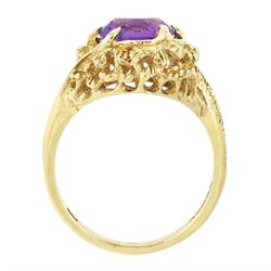 9ct gold amethyst single stone ring, round cut amethyst set within a pierced textured surround, London 1972