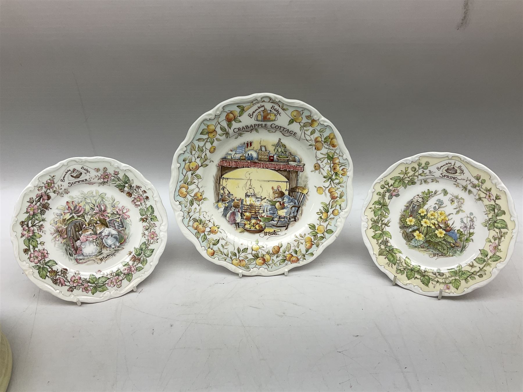Royal Doulton Brambly Hedge plates comprising Crabapple Cottage, Spring and Summer, together with Royal Doulton Bunnykins nursery plate, bowl, cup etc