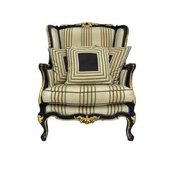 Thomas Messel - Georgian style ebonised and gilt wingback armchair, upholstered in striped fabric, on cabriole front feet
