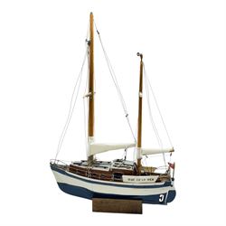 Scratch built model yacht 'Rue de la mer', with painted blue and white hull, with acrylic case, model H67.5cm