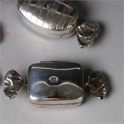 Four novelty silver pill boxes, in the form of wrapped sweets, all hallmarked, largest W6cm