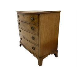 Early 19th century mahogany bow front chest, fitted with four graduating drawers, oval urn plate handles, on bracket feet