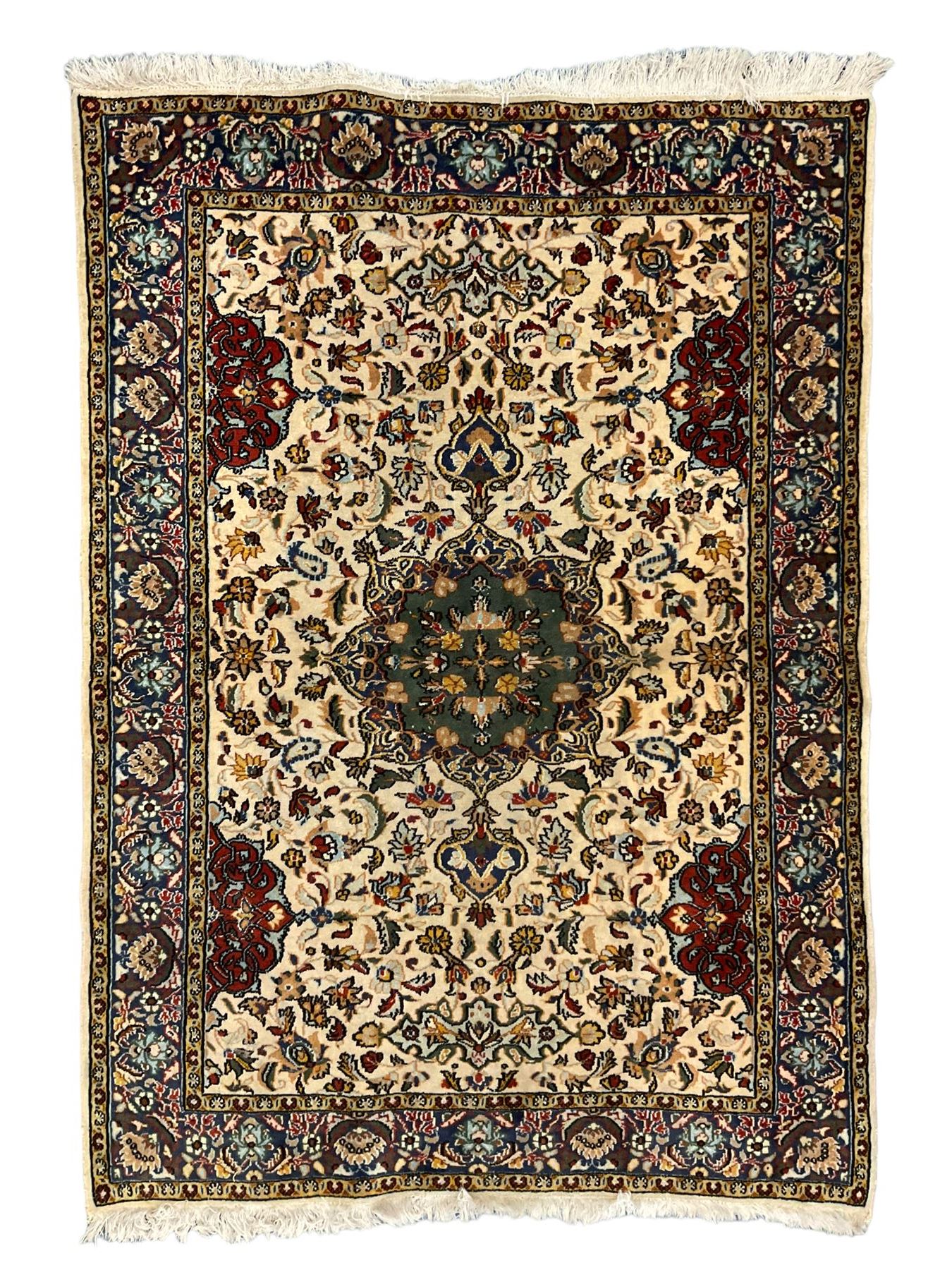 Persian ivory ground rug, central green floral pole medallion within a field decorated by scrolling foliate patterns, the guarded border with repeating palmettes and floral designs