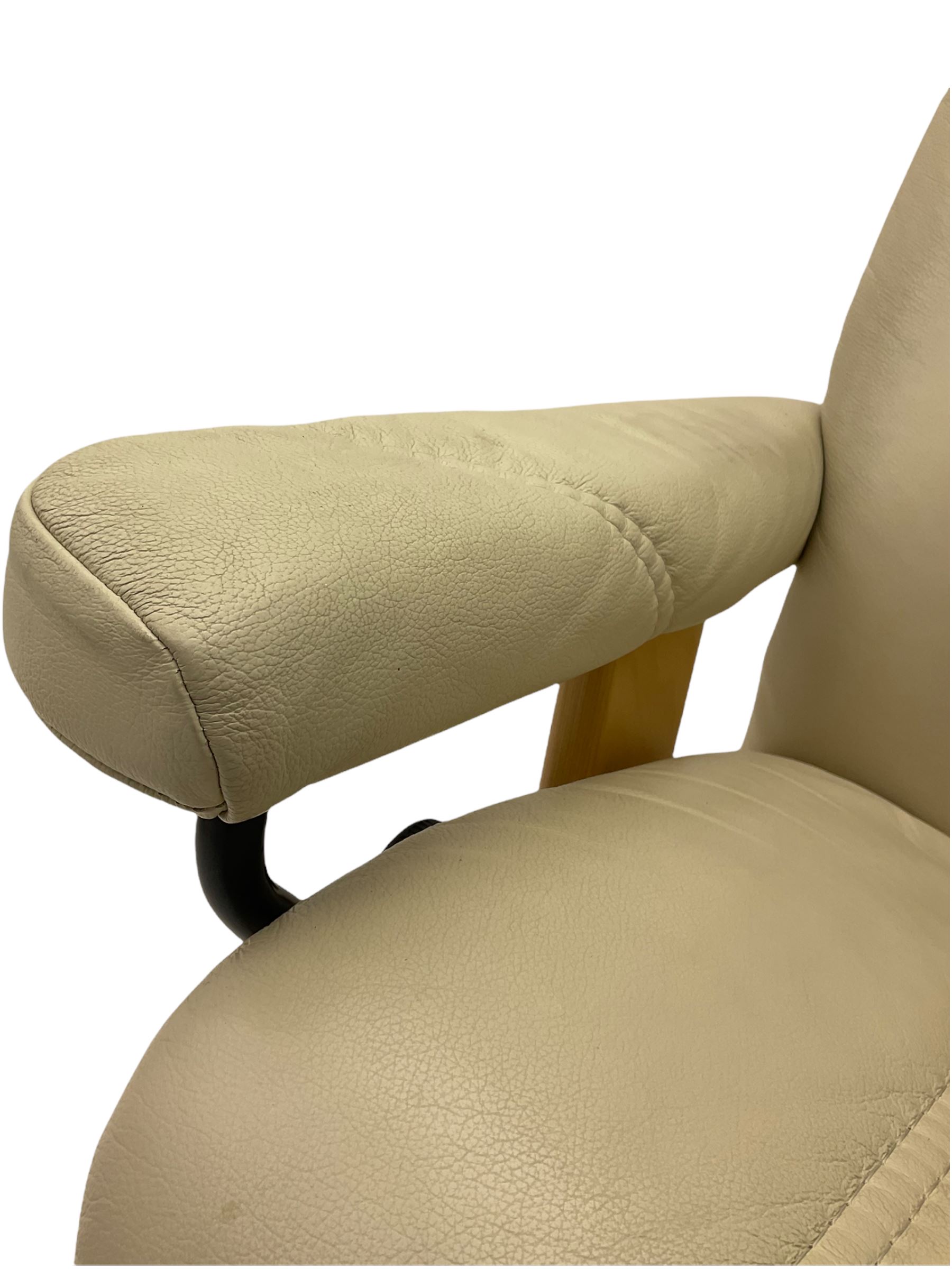 Ekornes - Stressless armchair upholstered in cream leather with matching footstool 