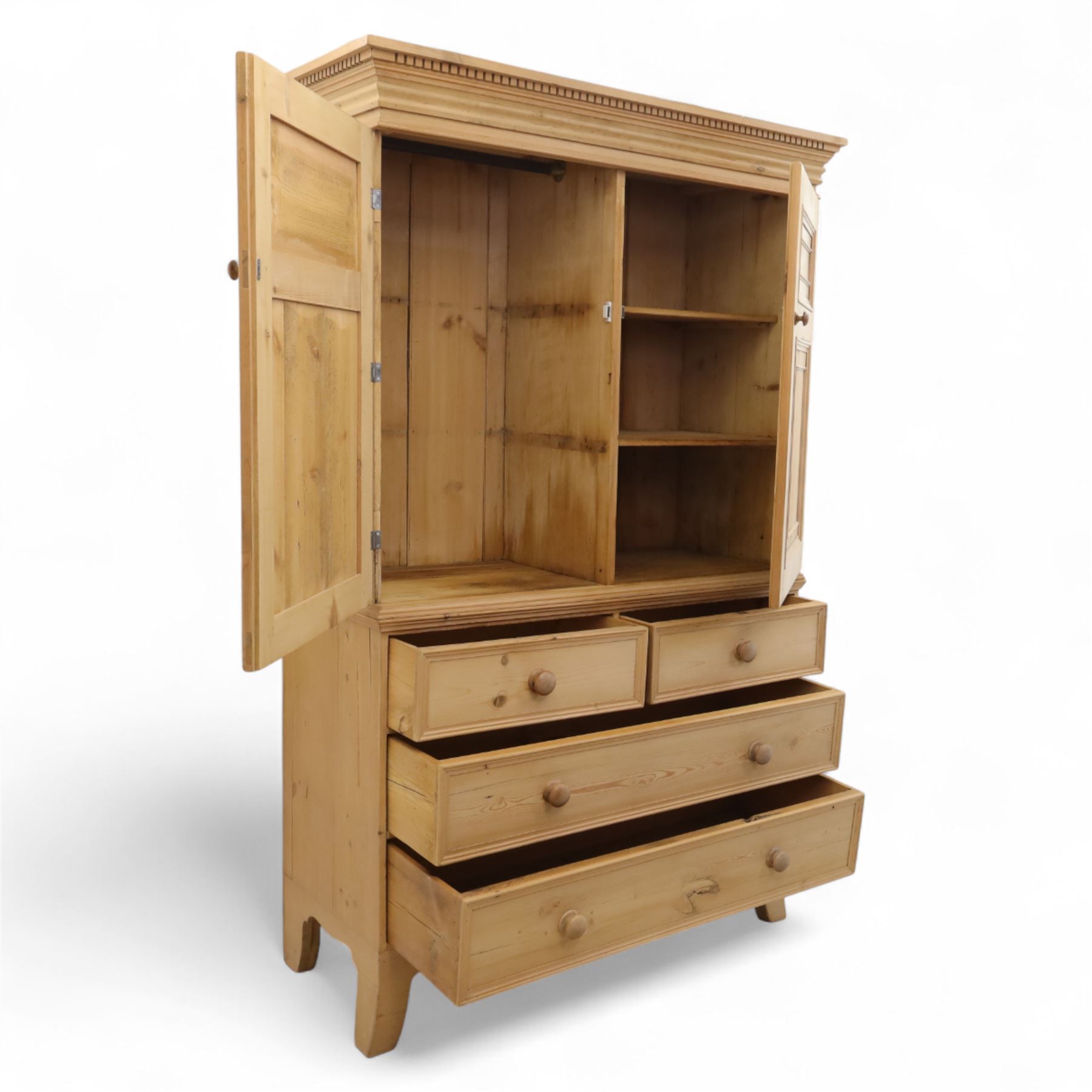 Georgian design waxed pine linen press, dentil moulded cornice above a pair of panelled cupboard doors enclosing storage interior, over two short and two long drawers with turned wooden knobs, raised on shaped bracket supports