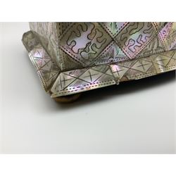 Victorian mother of pearl tea caddy, of rectangular bow-fronted form, the body with floral, bird and geometric engraved mother of pearl panels, white metal shield plaque to the cover inscribed with the initials G.J.A and similar escutcheon, the two division interior with ivory edging and two panelled mother of pearl lids, on four vegetable ivory bun feet L20cm, together with a similar style mother of pearl card case (2) This item has been registered for sale under Section 10 of the APHA Ivory Act