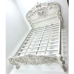 Victorian style small double bed, heavily carved with floral patterns, shaped supports in white finish 