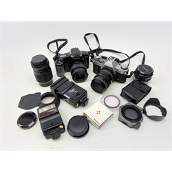  A Canon AE-1 camera, plus a Minolta Dynax 5000i camera, together with a selection of accessories, comprising various lenses, flashes and filters.   
