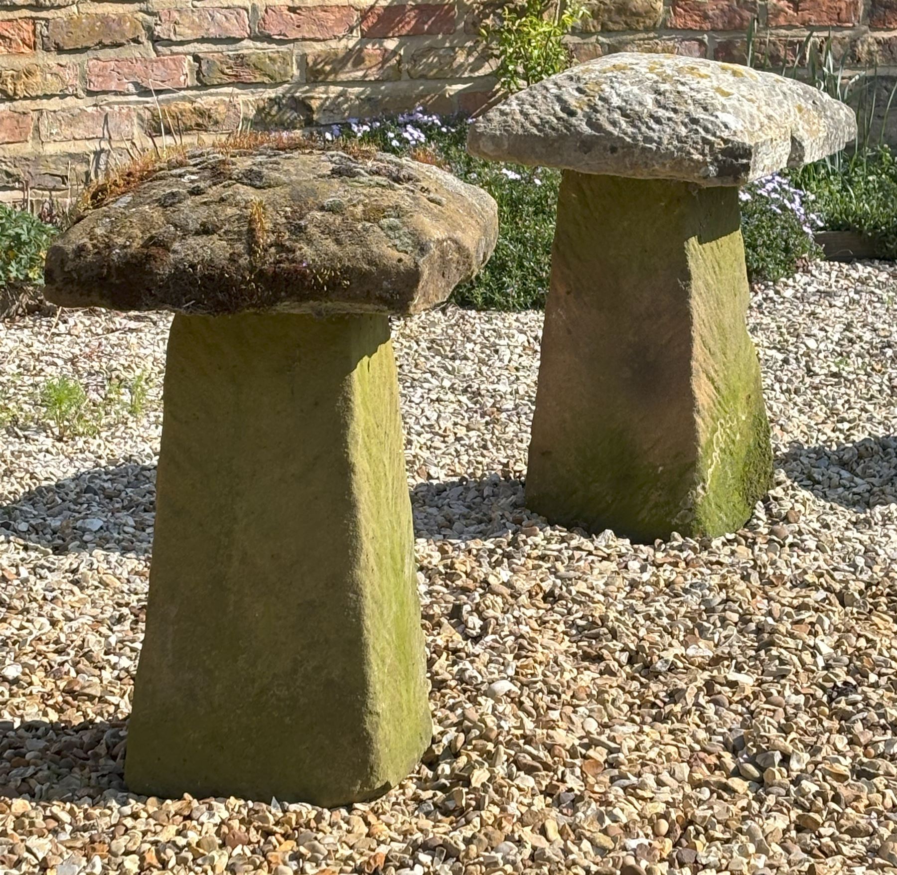 Pair of hewn sandstone staddle stones, each with square tops above tapered bases. H68cm, 44cm x 44cm.  - COLLECTION BY APPOINTMENT FROM: The White House, Thirsk Road, Easingwold, York, YO61 3NF - CALL 01723 507111 TO ARRANGE