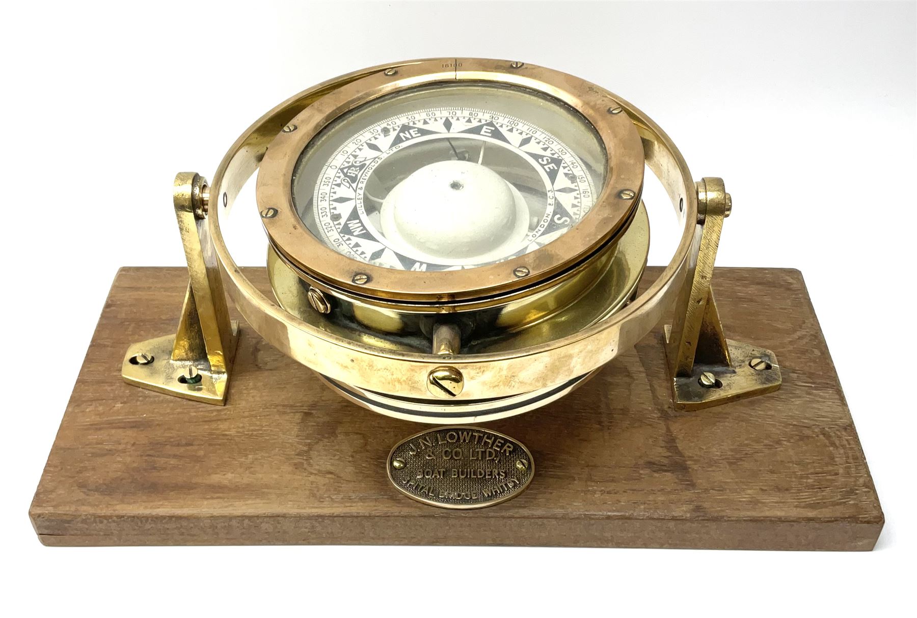 Lilley & Reynolds Ltd. ship's brass cased compass no.16100 D18.5cm with gimbal mount, fitted on an oblong hardwood base bearing brass plaque ' J.N. Lowther & Co. Ltd. Boat Builders Spital Bridge Whitby' L43cm