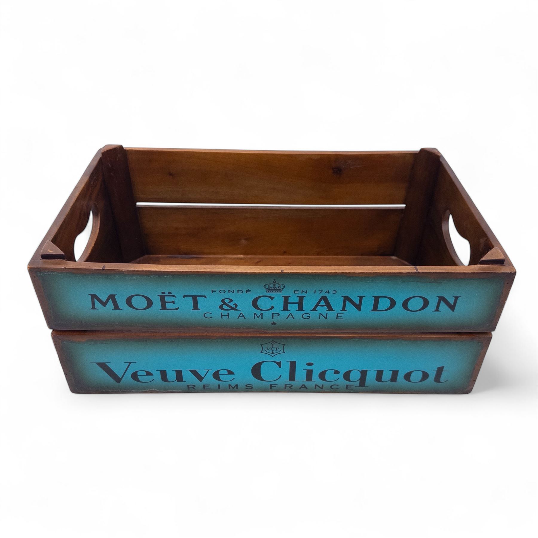Three-piece champagne advertising display set, comprising pine steps with painted Dom Pérignon and Bollinger lettering, and two wooden boxes branded Moët & Chandon and Veuve Clicquot (Steps H 80cm, W 44cm, D 68cm, crates each H 18cm, W 44cm, D 26cm)