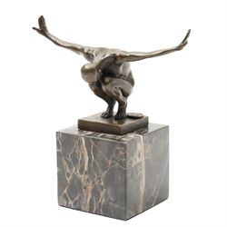 After Miguel Fernando Lopez (Portugese Contemporary):  Power of Silence, bronze modelled as a athlete crouched with arms outstretched, signed Milo, upon two tone marble plinth, overall H15cm
