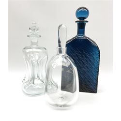 An Orrefors clear glass decanter of globular form, signed beneath, together with a clear glass glug-glug decanter, and a blue glass decanter with press moulded decoration, both probably Swedish. 