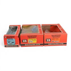 Britains Ltd 1:32 scale farm implements, comprising no. 9556 Hay Baler, no. 9549 Manure Spreader, no. 9553 Disc Harrow, no. 9557 Bale Sledge, no. 9577 Seed Drill, no. 9561 Cultivator Herse, no. 9546 Ploughs and no. 9558 Wheeled Trailer, all boxed