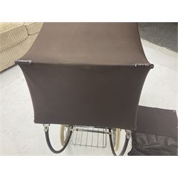 Pair of 1980s Silver Cross brown coach built dolls prams; each with folding canopy and apron, tubular framework with suspension, spoked wheels with brake and luggage rack and separate matching shopping bag L93cm