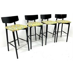 Four high black painted bar stools, upholstered seats, turned tapering supports joined by stretches