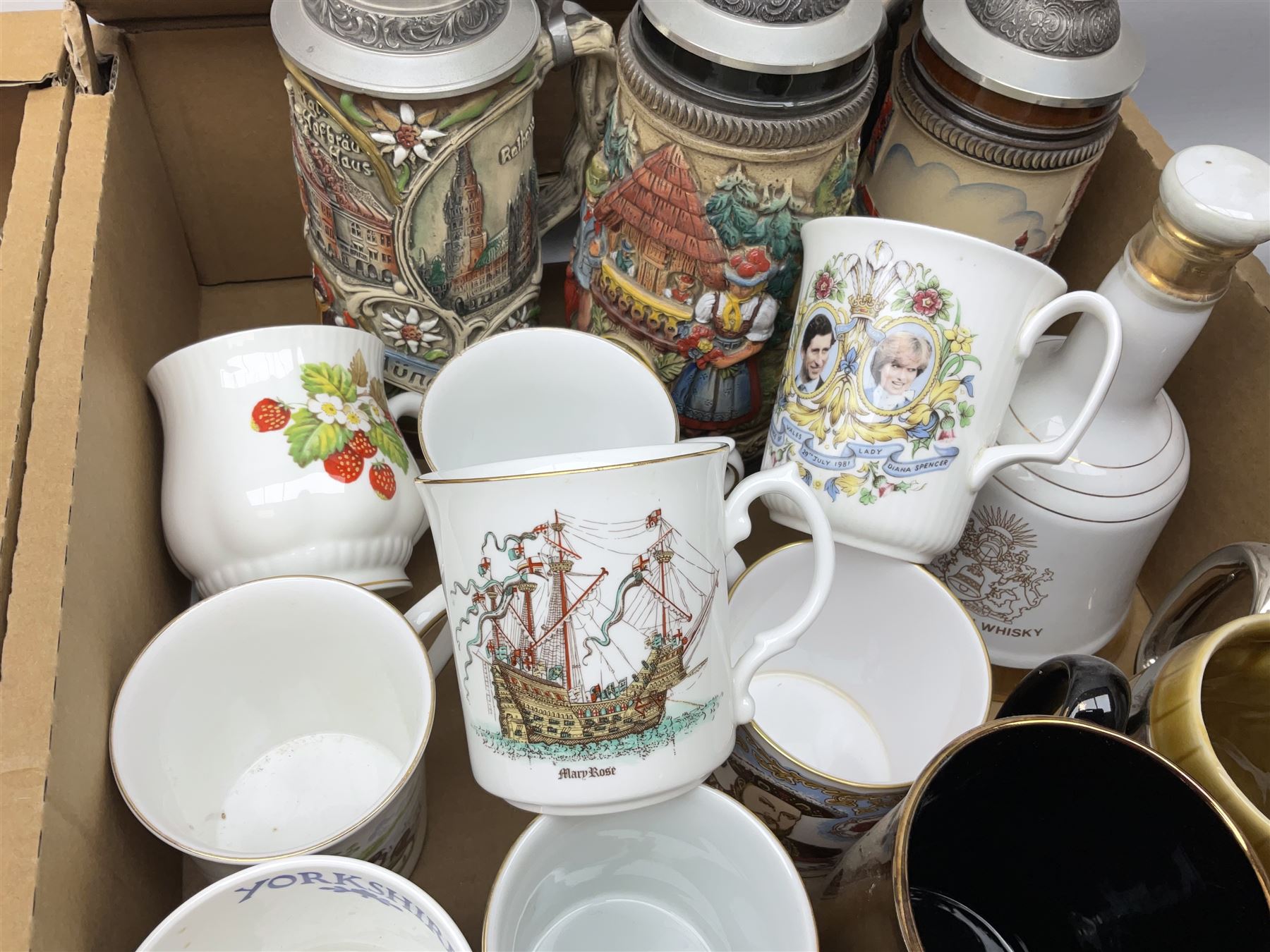 Large collection of glassware to include carnival glass, art glass paperweight, coloured glass, uranium glass, together with three covered steines, ceramic decanters etc, in four boxes 