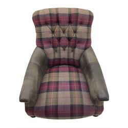 John Sankey - low armchair, buttoned back upholstered in tartan patterned fabric with contrasting grey leather, raised on turned and ebonised front feet with brass and ceramic castors, with matching foot stool