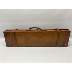 Early 20th century leather and brass mounted gun case, with vacant brass plaque to cover, twin leather straps and carry handle, opening to reveal and green baize lined interior, L81cm
