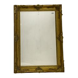 Rectangular wall mirror in gilt swept frame, bevelled plate