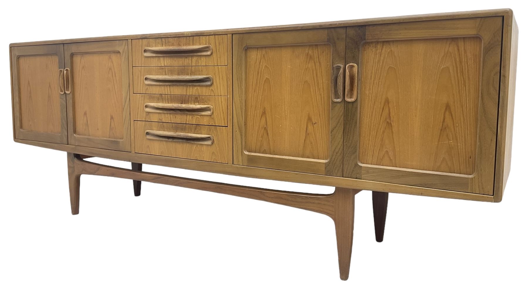 G-Plan – teak sideboard, four central drawers flanked by two double cupboards, enclosed by panelled doors 