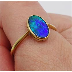 Gold single stone oval black opal ring, stamped 18ct, makers mark WG&S