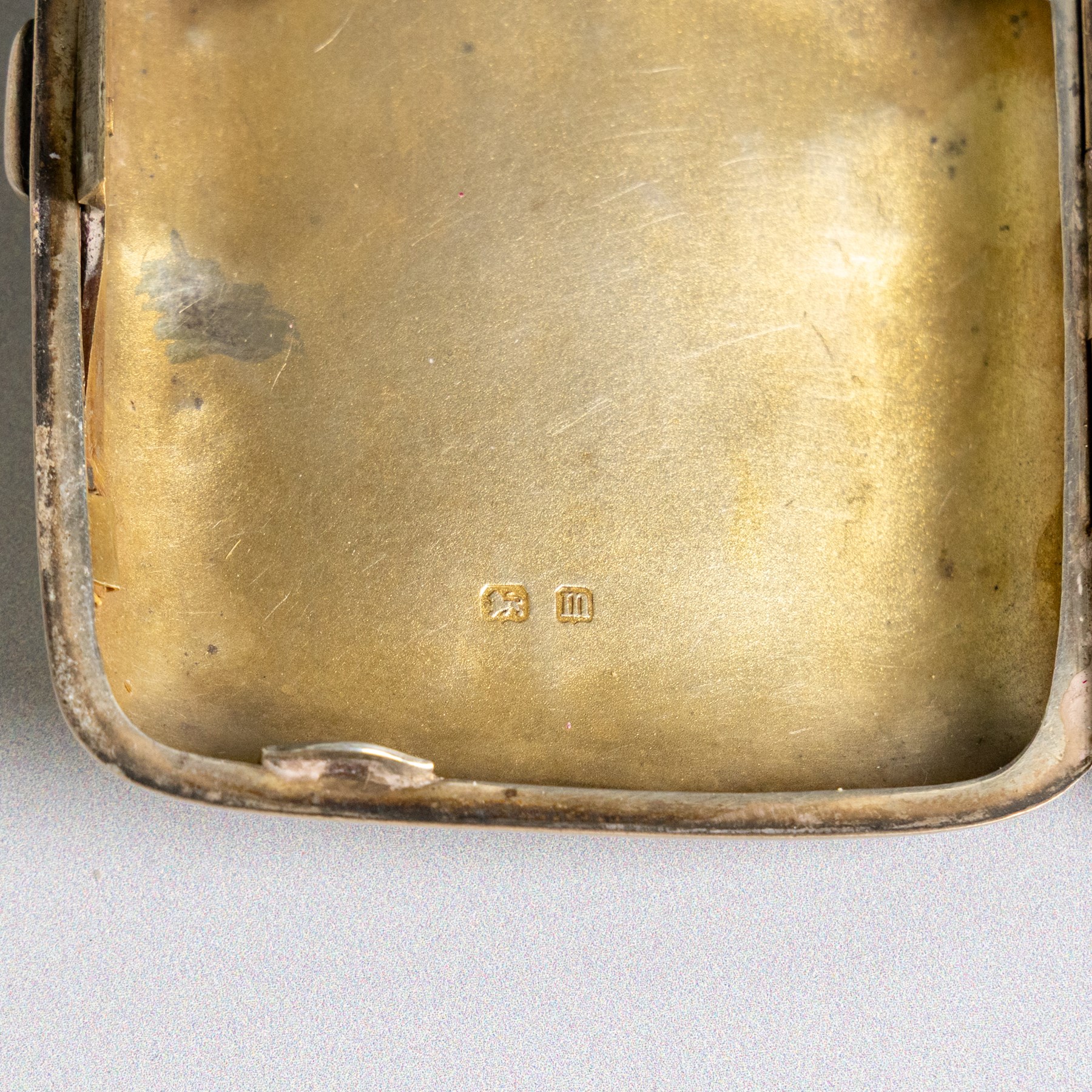 Early 20th century silver coin purse, with floral decoration and finger chain, hallmarked together with an early 20th century cigarette case,  with engraved initials, hallmarked and a silver filigree cigarette case