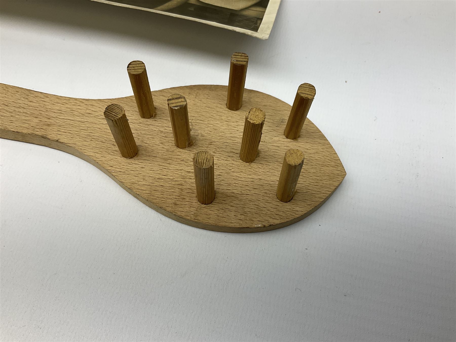 Early 1970s sepia photograph of the Pools Panel meeting at The Waldorf Hotel, London including Raich Carter, Marquis of Bath, Arthur Ellis, Neil Franklin etc 19 x 25cm; together with a beech spaghetti server with manuscript presentation inscription 'To Raich Carter from Henry 6th Marquis of Bath 1974'; Provenance: By direct descent from the family of Raich Carter having been consigned by his daughter Jane Carter (2)