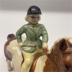 Beswick Boy on Palomino Pony no 1500 and Girl on Skewbald Pony no 1499, both with printed mark beneath 