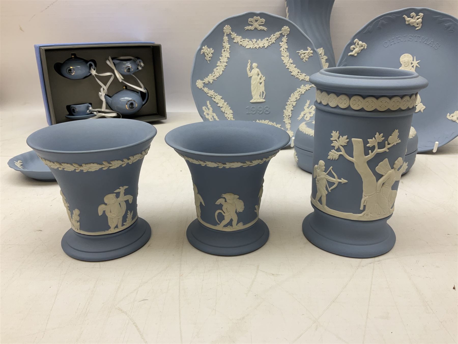 Wedgwood pale blue Jasperware, to include a pair of tulip vases, large vase with fluted rim, trinket dishes, trinket box etc, together with Wedgwood miniature hanging decoration in the form of a tea set 