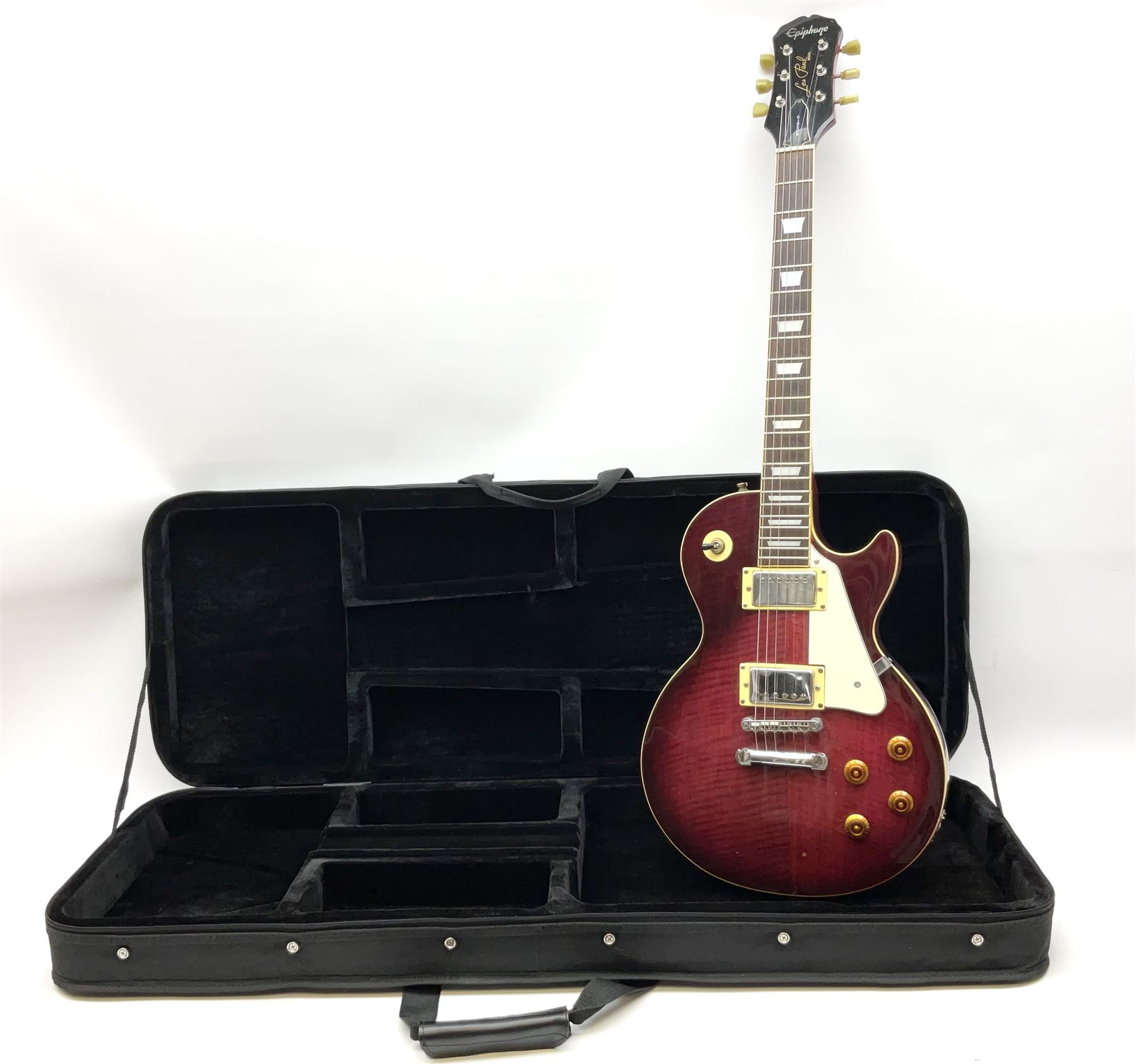 1980s Les Paul Epiphone limited edition cut-away electric guitar by Gibson, the burgundy coloured body with two pick-ups, volume and tone knobs and scratch plate, original tuning pegs, serial no.U6030215, 101cm overall; in modern Kinsman fitted carrying case