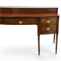 Large George III mahogany bowfront sideboard, the shaped top with raised superstructure fitted with three compartments with hinged tops and reeded edge, the body fitted with two central cock-beaded frieze drawers, flanked by a cellarette drawer and hinged cupboard both with faux double drawer facias, raised on ring turned tapering supports
Provenance: Kirkham Hall
