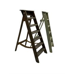 Early 20th century pine library or shop step ladder, seven tread (W45cm H135cm); together with another similar with painted laurel green finish (H135cm)