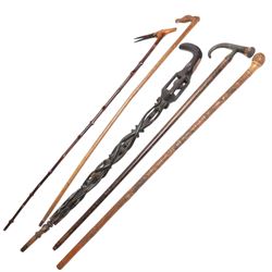 Collection of walking sticks including Greek racing walking stick, carved horse head and j...