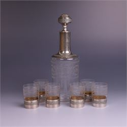 French silver mounted glass decanter and shot glass set, the decanter with silver covered ...