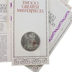 John Pinches 'The 100 Greatest Masterpieces' set of one hundred silver medallions, each on presentation card with information leaflet, together with the corresponding wooden display cabinet